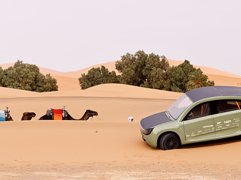 solar car Student Team Eindhoven, shown with camels in the Sahara. Credit: STE / Bart van Overbeeke